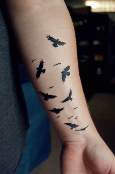 arm bird tattoos